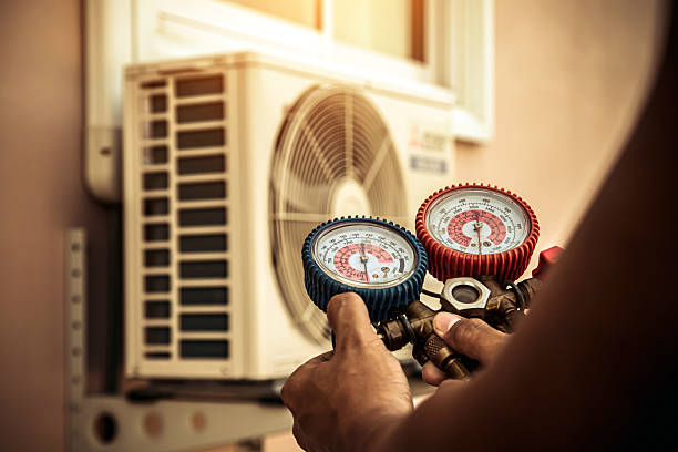 Professional Air Conditioning Service technician working in Cushing, OK
